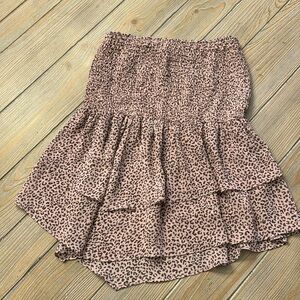 Strapless top size medium with elastic top and peplum layered ruffle bottom.